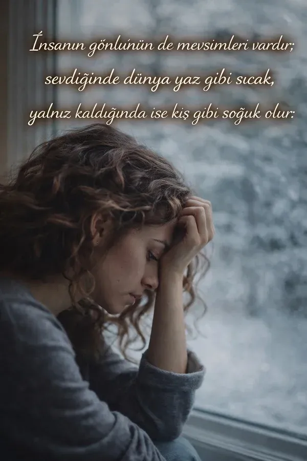 Cam kenarında düşünceli ve üzgün bir kadın portresi