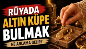 Rüyada Altın Küpe Bulmak Ne Anlama Gelir başlıklı, takı kutusundan alınan parlak altın küpelerin yer aldığı sıcak altın ve siyah tonlarda hazırlanmış blog kapak görseli.