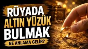 Rüyada altın yüzük bulmak ne anlama gelir başlıklı kapak görselinde, kumlu zeminden alınan parlak altın bir yüzük ve büyük tipografik başlık yer alıyor.